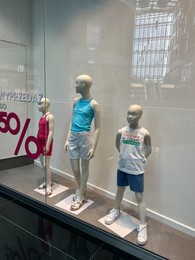 Photo of WARSAW, POLAND - JULY 23, 2022: Fashion store showcase with mannequins in shopping mall