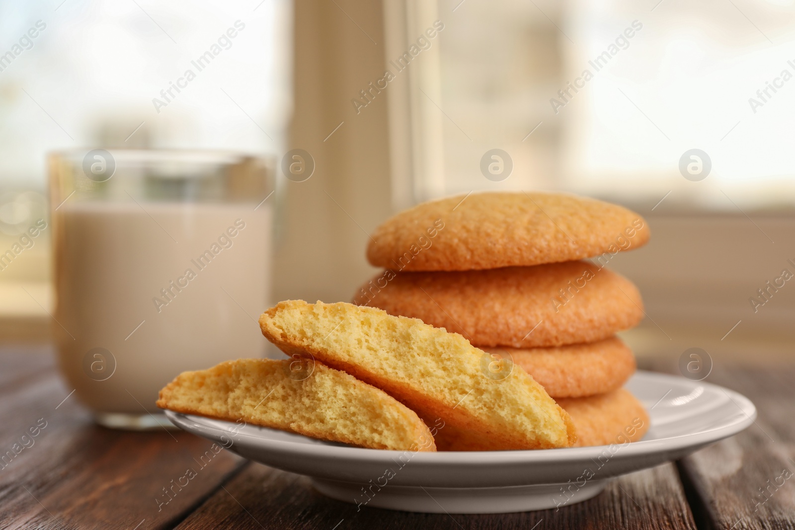Photo of Delicious Danish butter cookies on wooden table, closeup