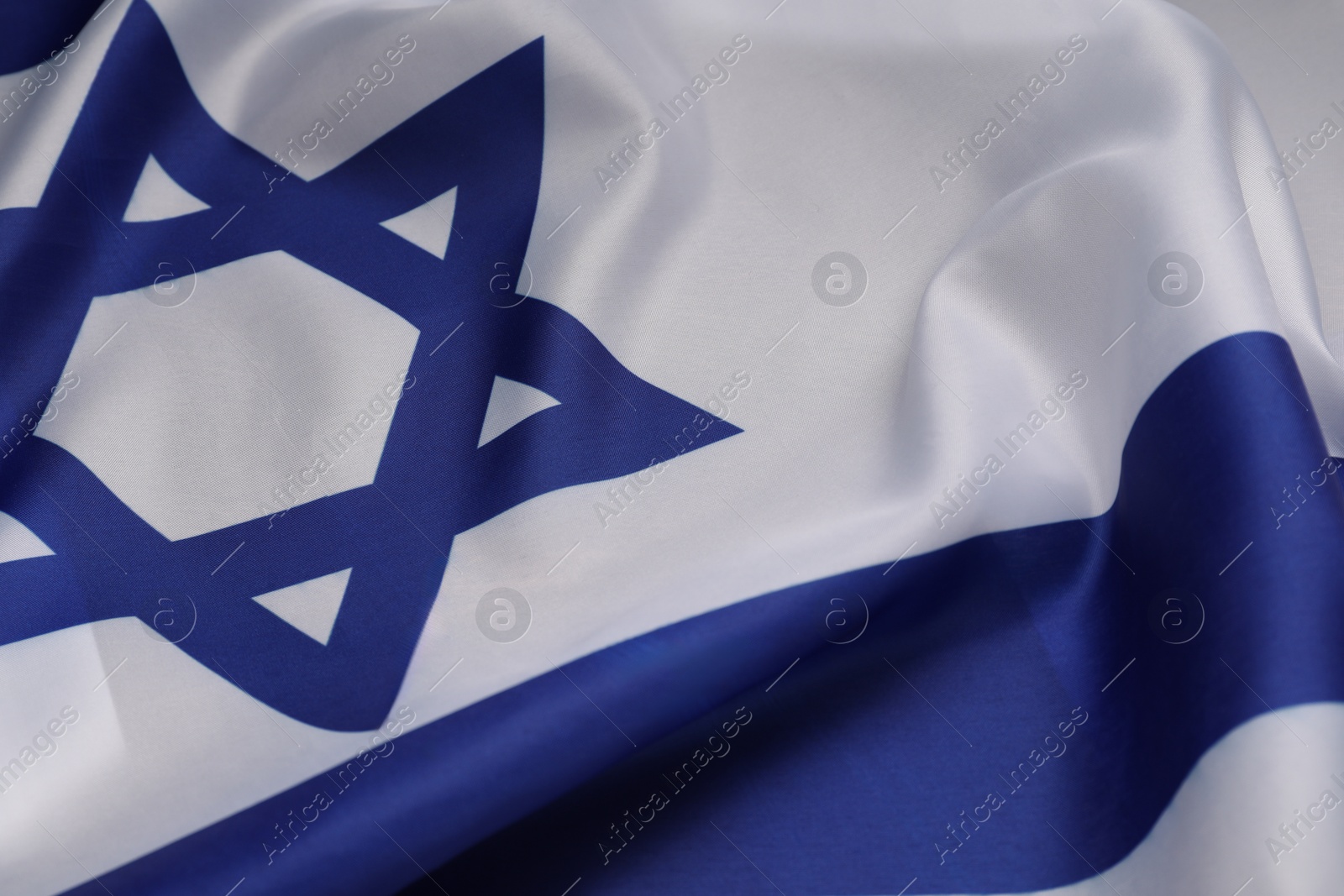 Photo of Flag of Israel on light background, closeup. National symbol