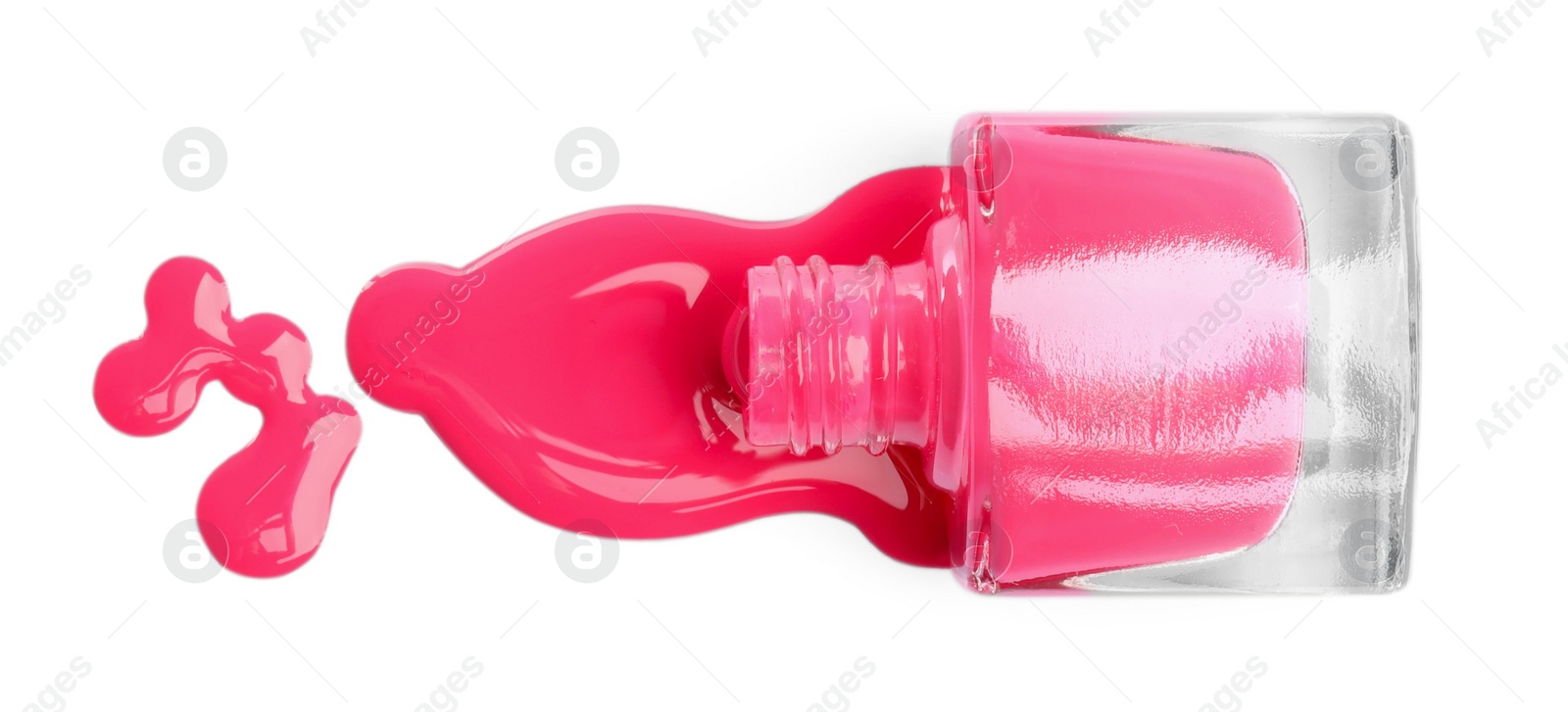 Photo of Bottle and spilled pink nail polish isolated on white, top view