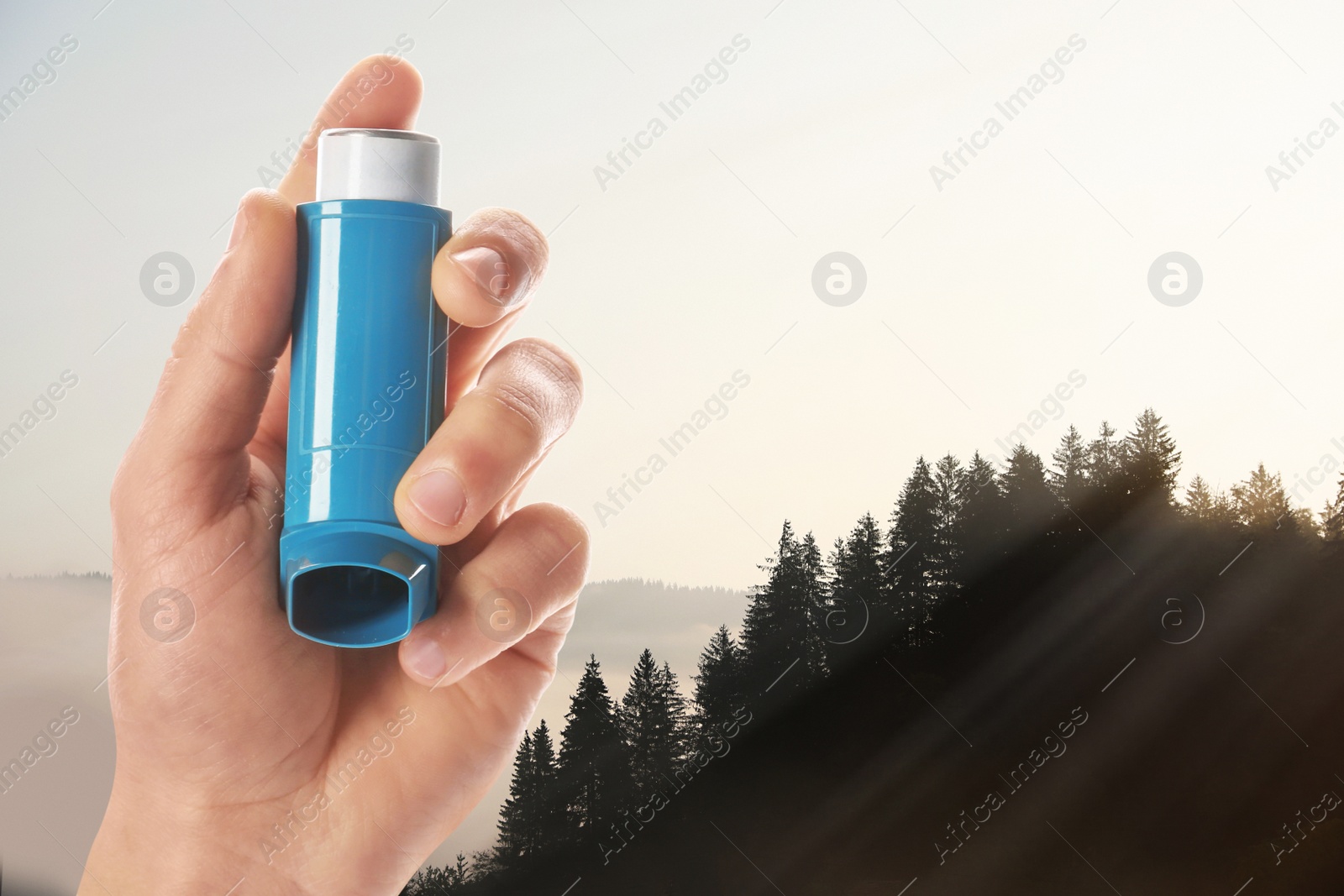 Image of Man with asthma inhaler in mountains, closeup. Emergency first aid during outdoor recreation