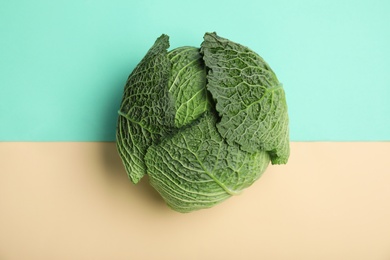 Photo of Fresh green savoy cabbage on color background, top view