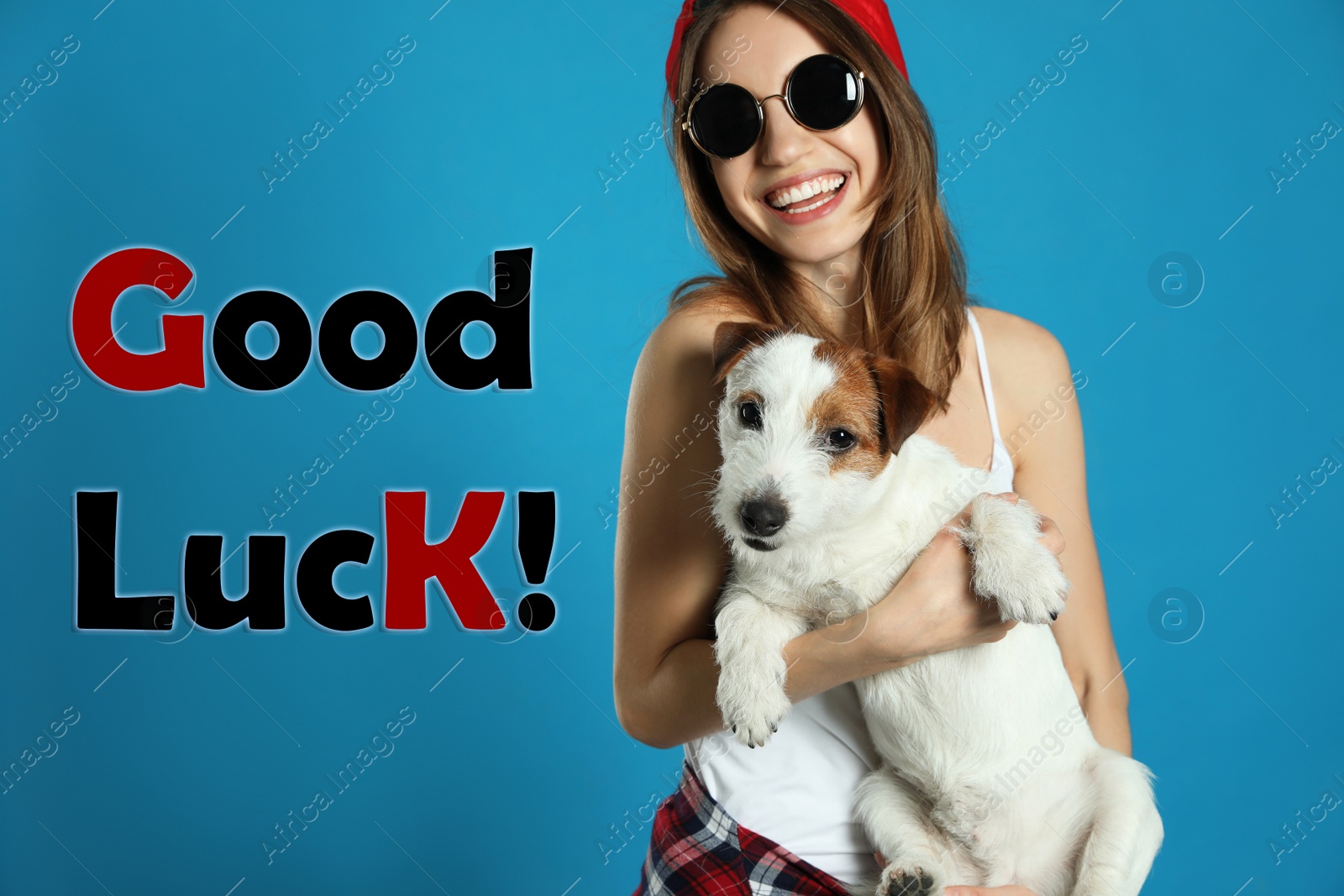 Image of Young woman with her dog and phrase GOOD LUCK on light blue background