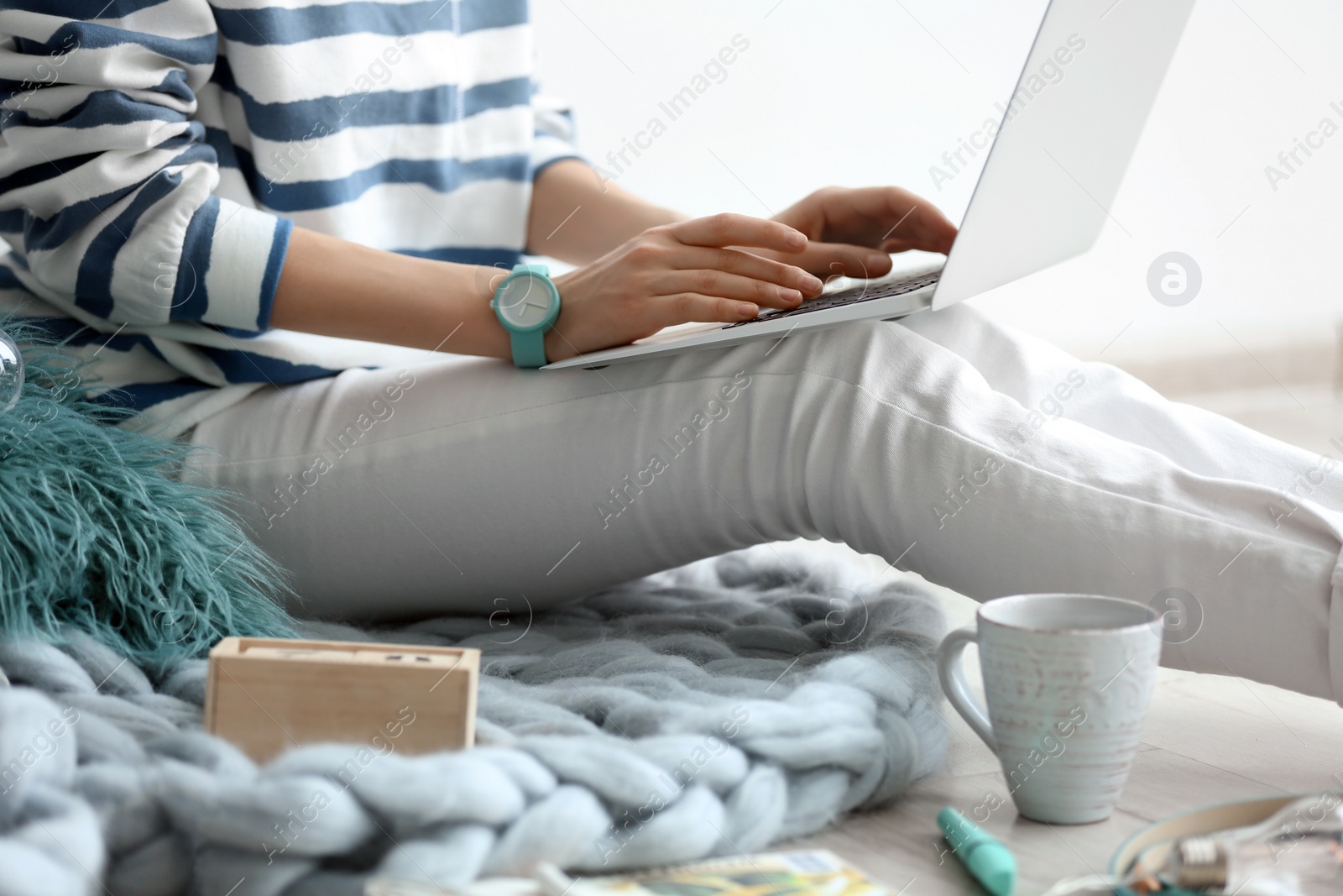 Photo of Female blogger with laptop indoors