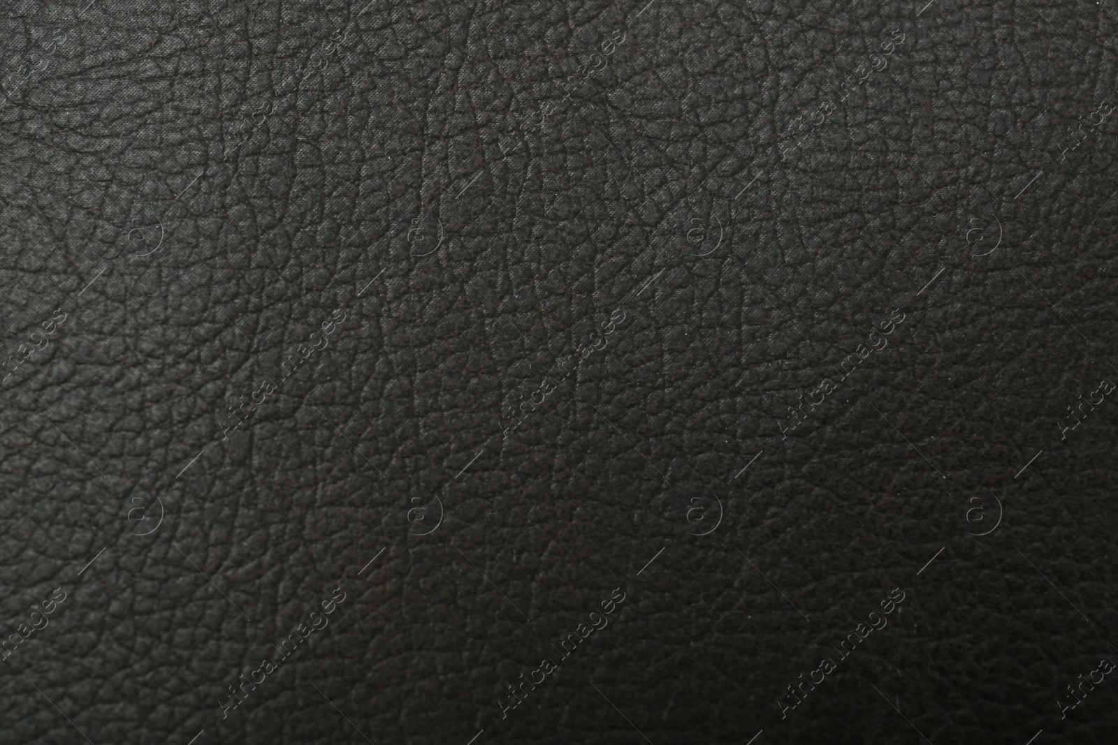 Photo of Black natural leather as background, top view