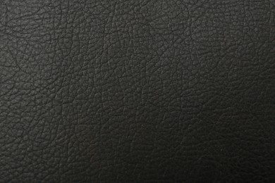 Photo of Black natural leather as background, top view