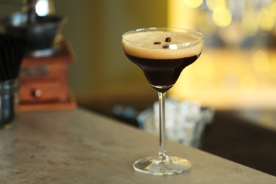 Photo of Fresh alcoholic Martini Espresso cocktail on bar counter