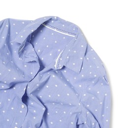 Crumpled light blue polka dot blouse on white background, top view. Space for text
