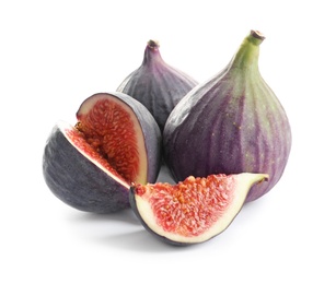 Photo of Whole and cut purple figs on white background