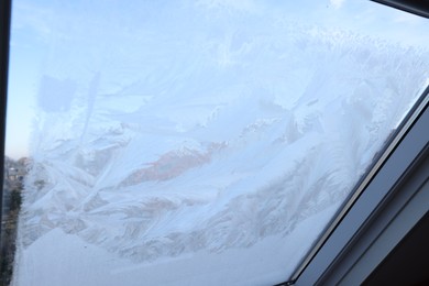 Photo of Window covered with beautiful frost. Winter morning