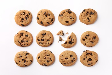 Photo of Many delicious chocolate chip cookies on white background, flat lay