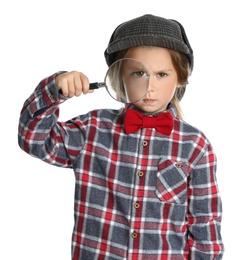 Photo of Cute little child in hat with magnifying glass playing detective on white background