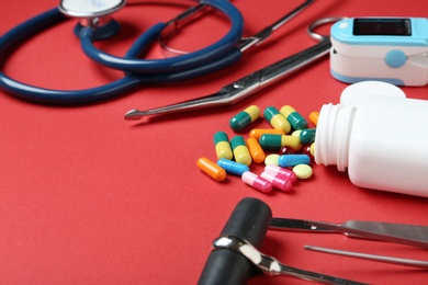 Different medical objects on color background, closeup