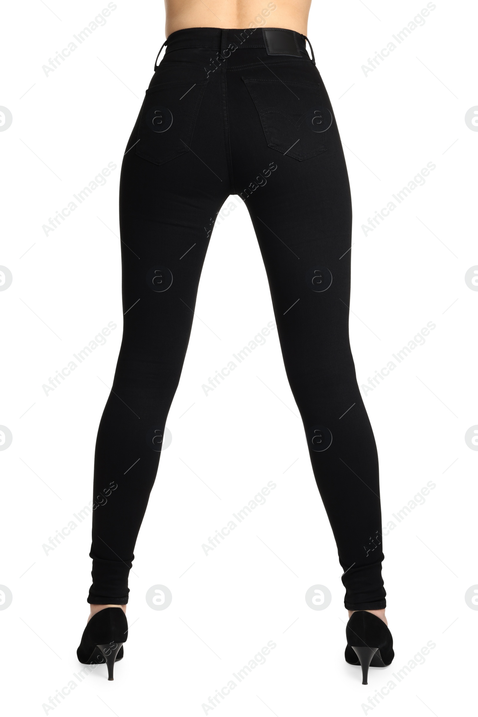 Photo of Woman wearing stylish black jeans and high heels shoes on white background, closeup