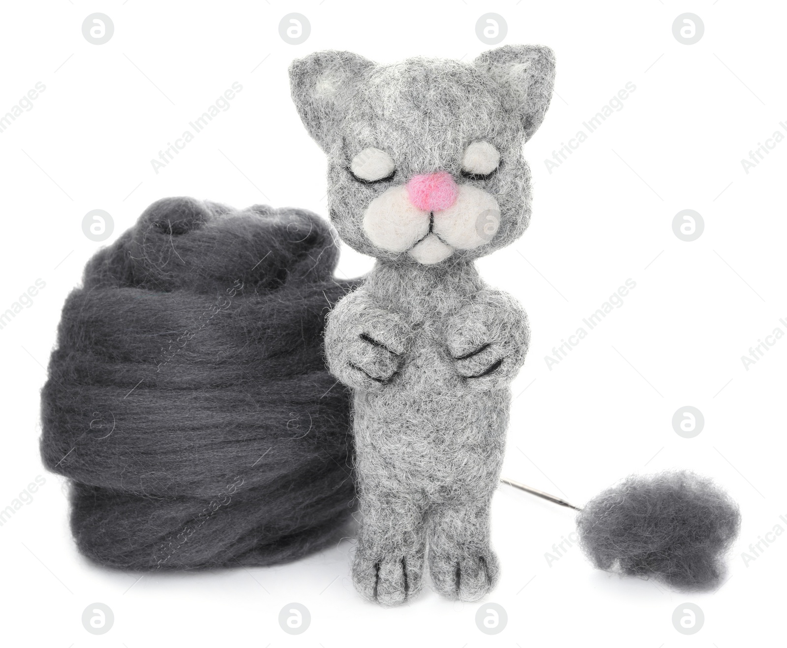 Photo of Needle felted cat and wool isolated on white