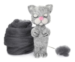 Photo of Needle felted cat and wool isolated on white