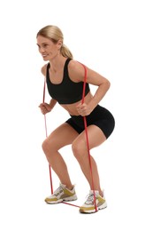 Woman exercising with elastic resistance band on white background