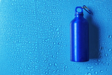 Photo of Sports water bottle on color background. Space for text