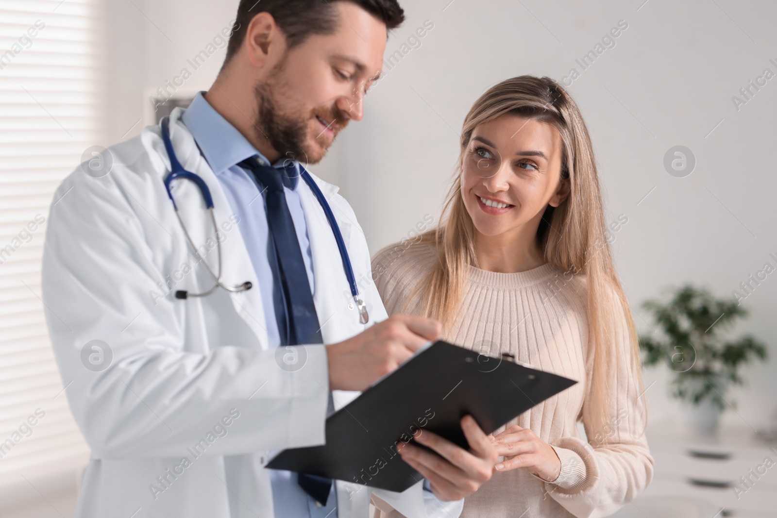 Photo of Professional doctor working with patient in hospital