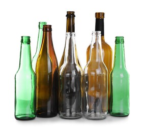 Photo of Many different glass bottles on white background. Recycling rubbish