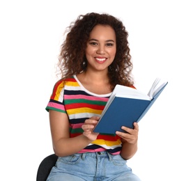 Beautiful African-American woman with book on white background. Reading time