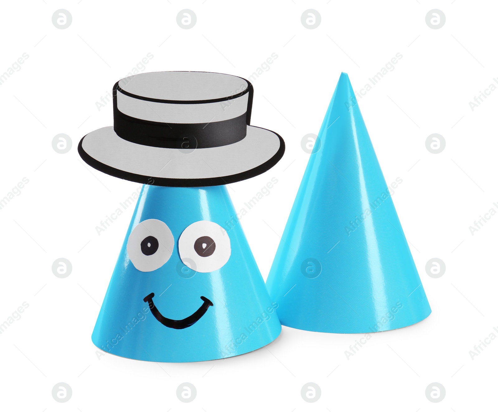 Photo of Handmade party hats with funny face isolated on white