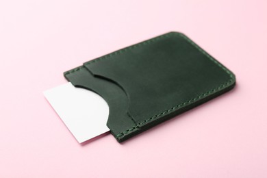 Leather business card holder with blank card on pink background