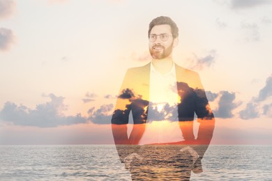 Image of Double exposure of handsome businessman and sea at sunset
