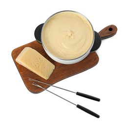 Fondue with tasty melted cheese, forks and piece isolated on white, top view