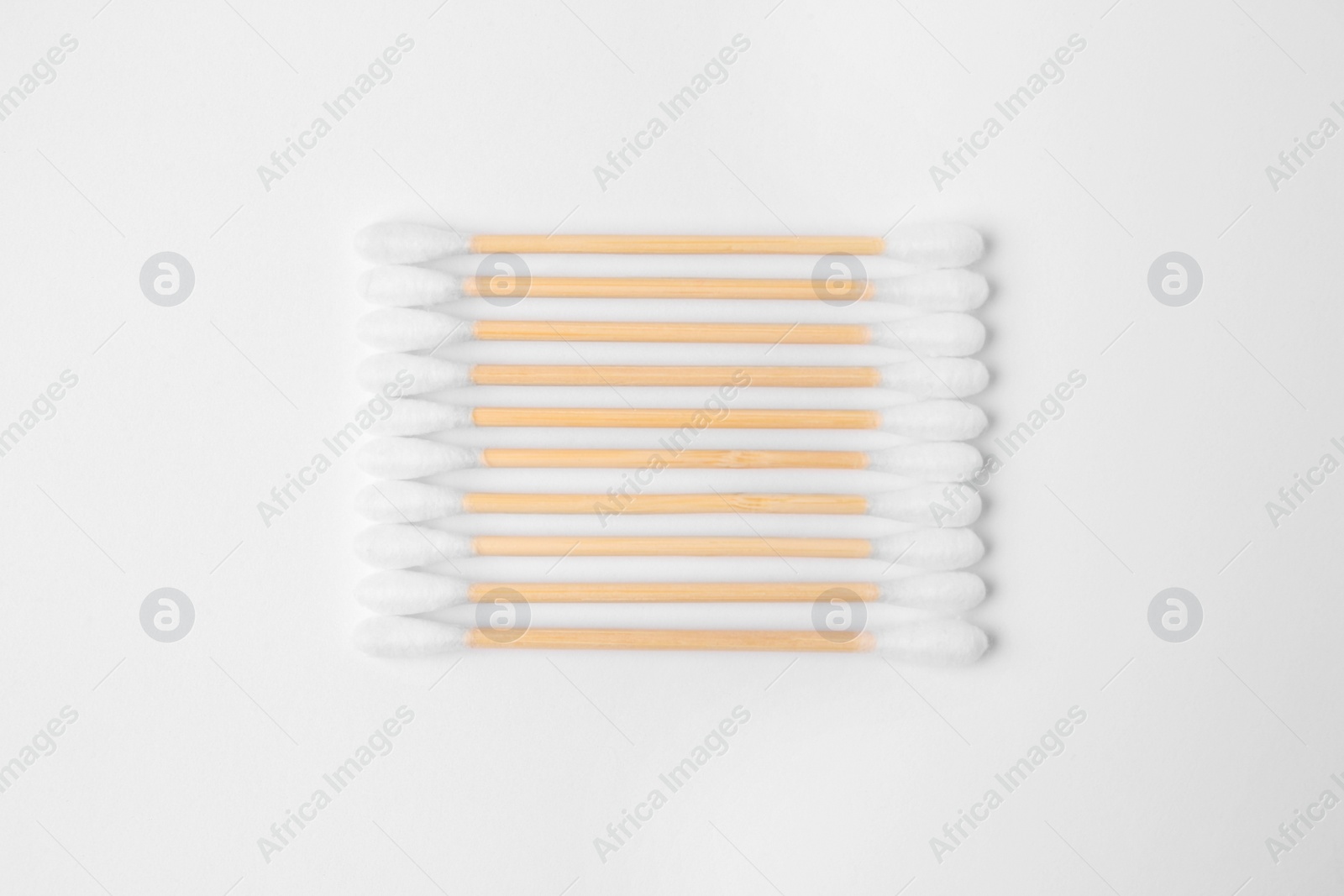 Photo of Many clean cotton buds isolated on white, top view