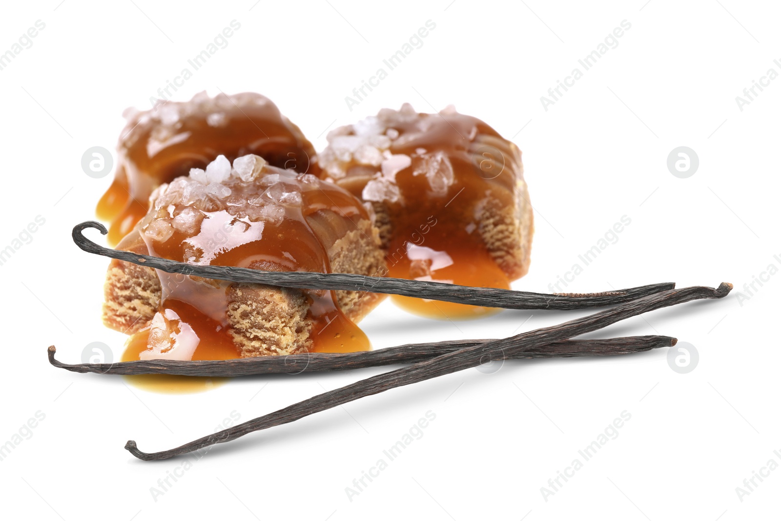 Image of Delicious salted caramel with sauce and vanilla pods isolated on white