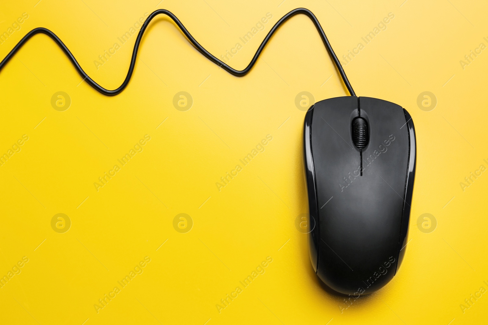 Photo of Modern computer mouse on color background, top view