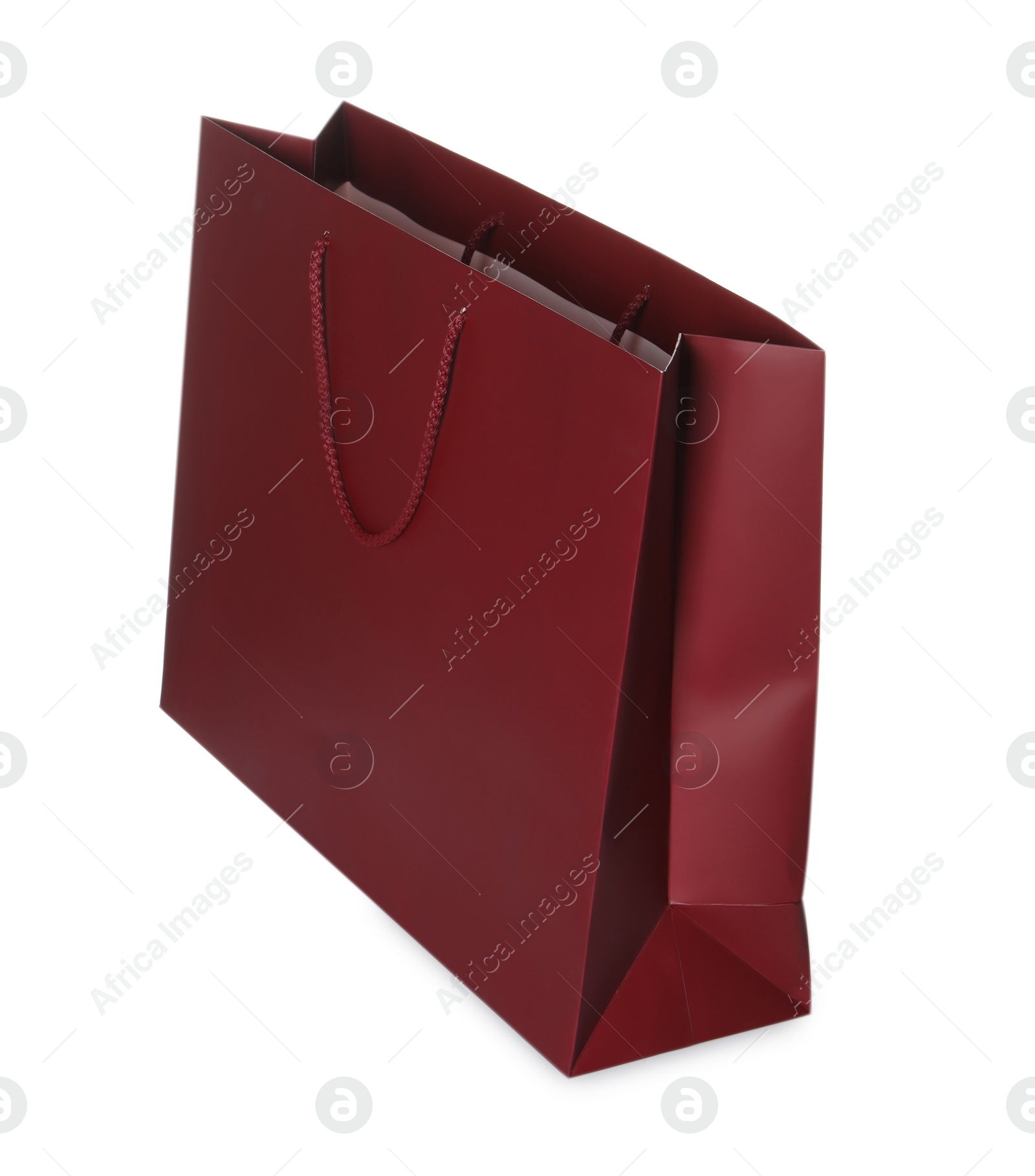 Photo of One red shopping bag isolated on white