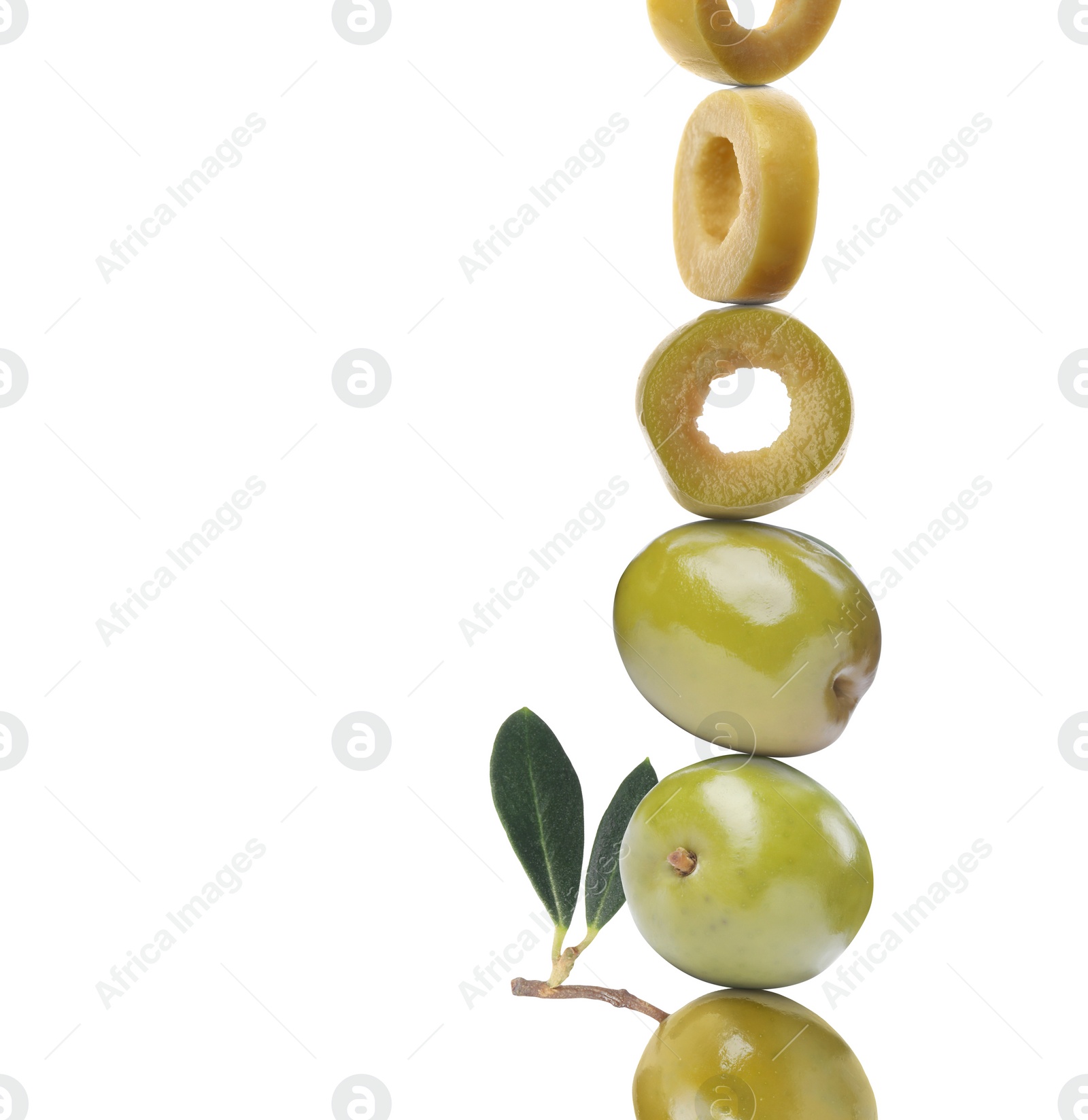 Image of Cut and whole green olives with leaves on white background