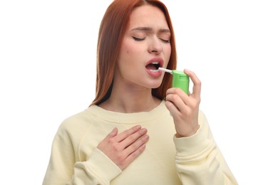 Photo of Young woman using throat spray on white background