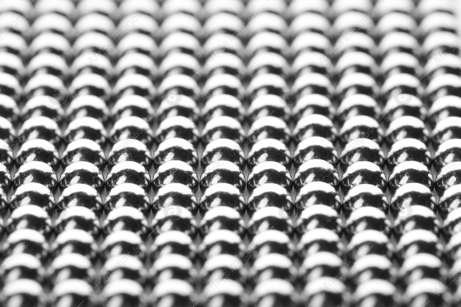 Photo of Small metal magnetic balls as background, closeup