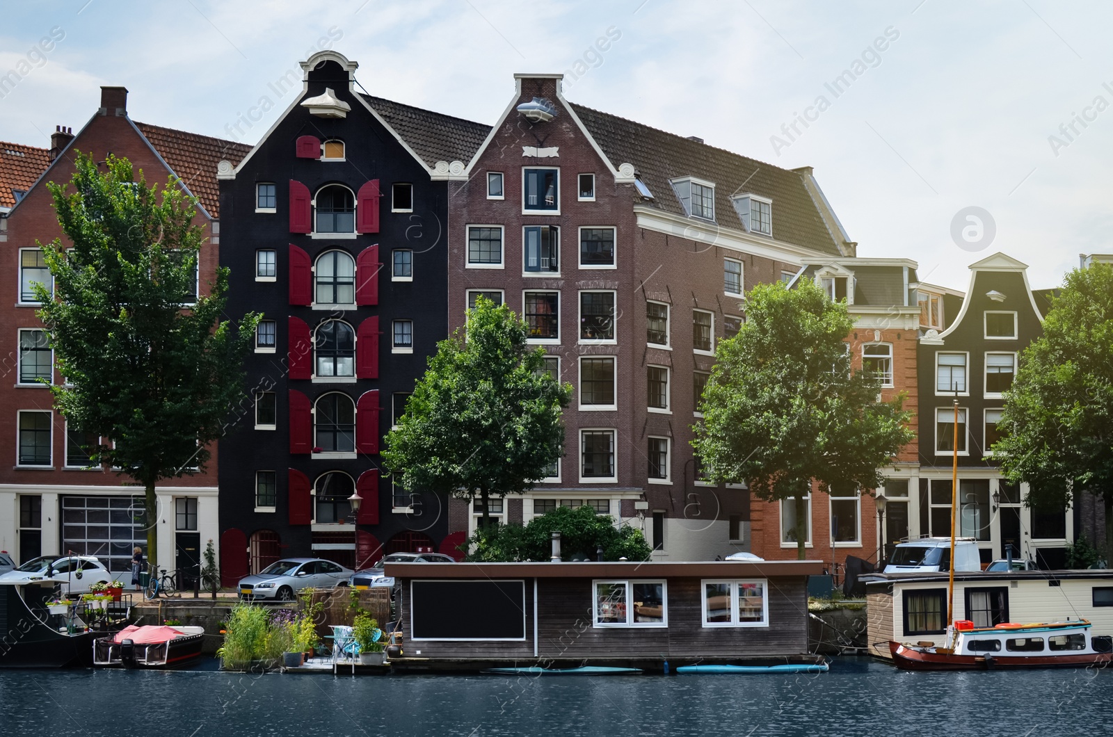 Photo of Picturesque view of town with beautiful buildings near river