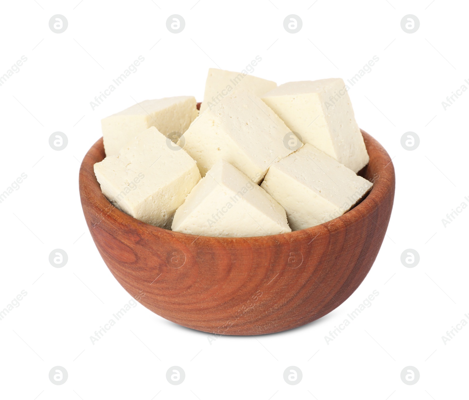 Photo of Wooden bowl with delicious tofu isolated on white