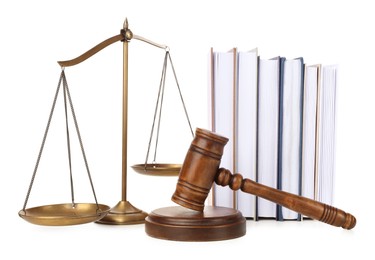 Photo of Wooden gavel, books and scales of justice on white background