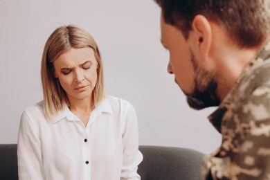 Psychologist working with military officer in office