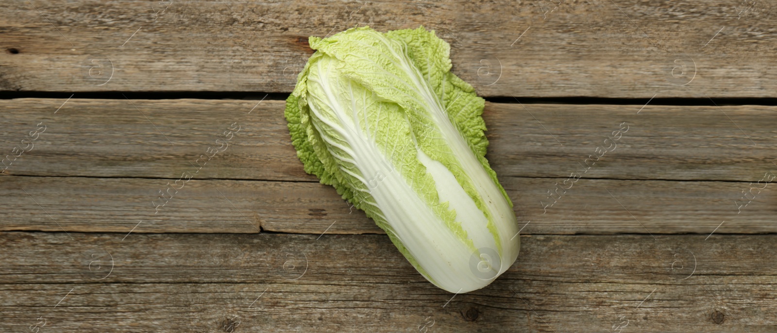 Image of Fresh ripe Chinese cabbage on wooden table, top view. Banner design