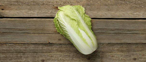 Image of Fresh ripe Chinese cabbage on wooden table, top view. Banner design