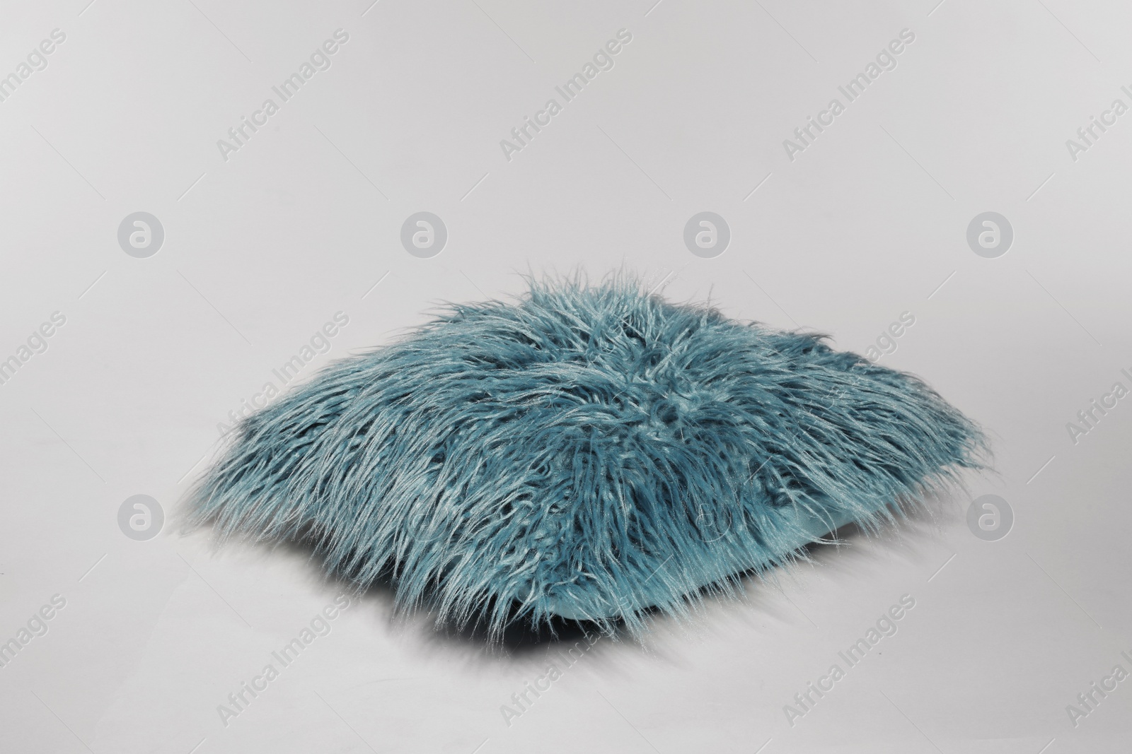 Photo of Single stylish decorative pillow on light background