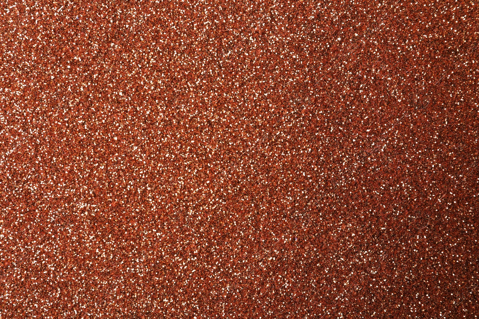 Photo of Beautiful shiny copper glitter as background, closeup