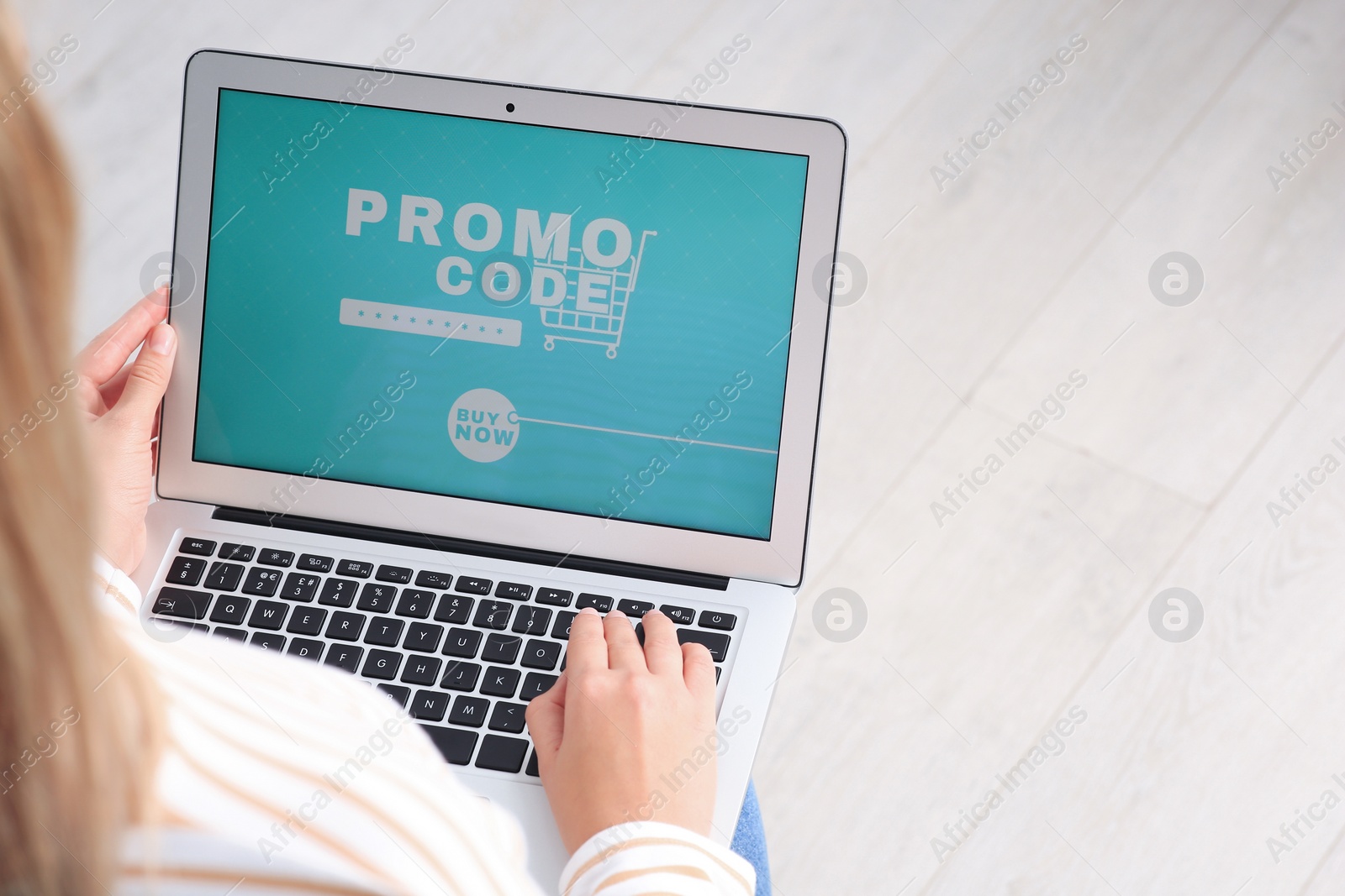 Photo of Woman with laptop activating promo code while doing online shopping, closeup. Space for text