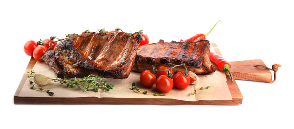 Photo of Tasty grilled ribs with tomatoes and peppers isolated on white