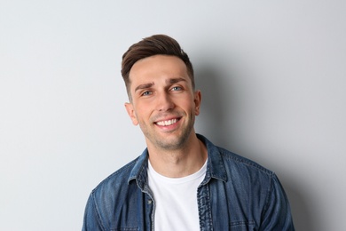 Photo of Portrait of handsome man on light background