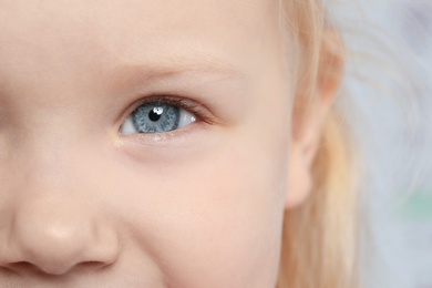 Photo of Little girl, focus on eye. Visiting children's doctor and ophthalmologist