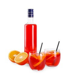 Photo of Aperol spritz cocktail, straws and orange slices in glasses isolated on white