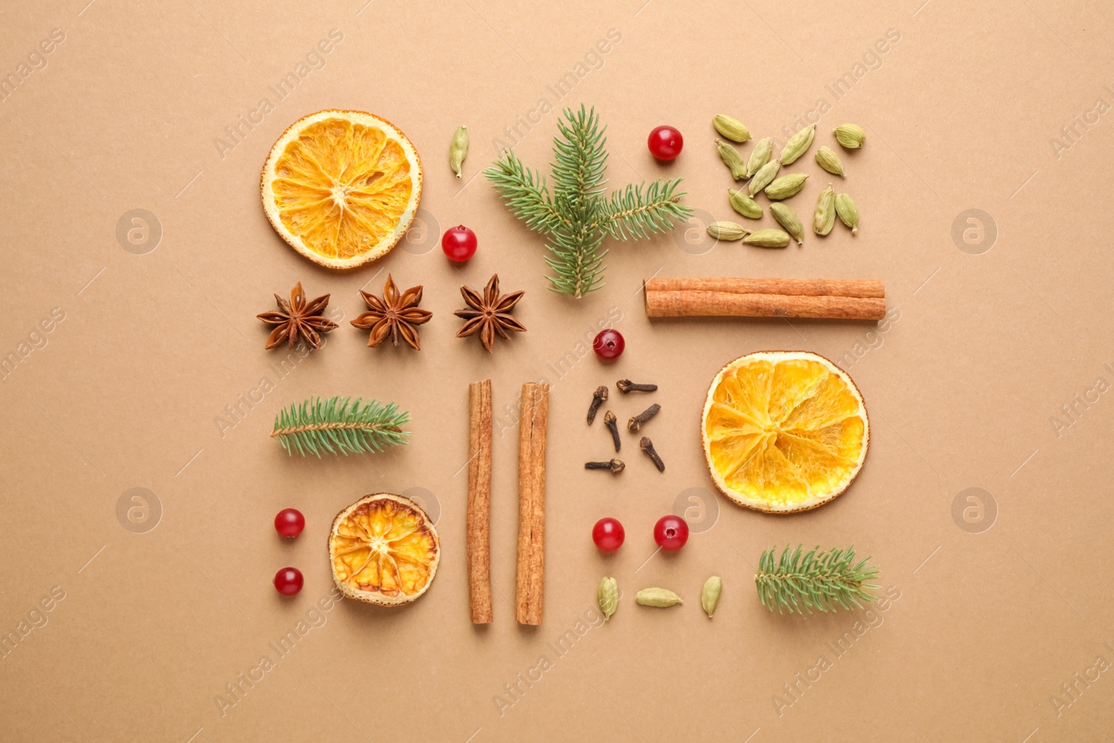 Photo of Flat lay composition with mulled wine ingredients and fir branches on brown background